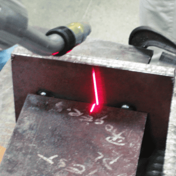 Red laser marking on metal block