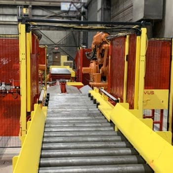 Conveyor system with safety guards and robot
