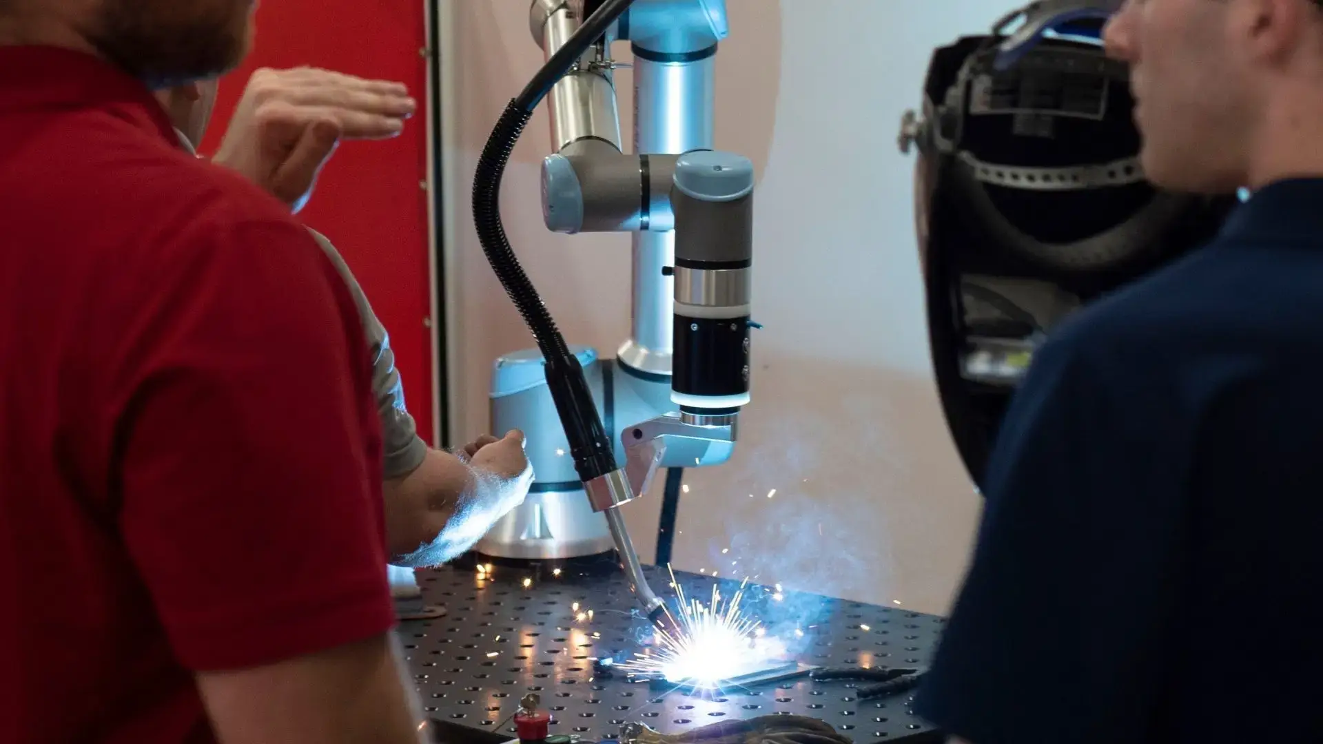 Cobot welding demonstration with observers